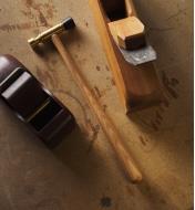 The Wile plane hammer and wooden planes on a work surface