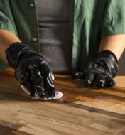 Applying stain to wood while wearing Grease Monkey nitrile gloves