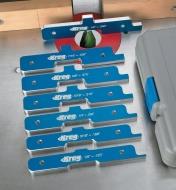A set of seven Kreg set-up bars displayed on a router table