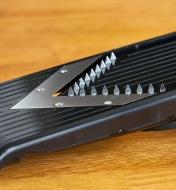 Close-up view of the julienne blade on the V-slicer