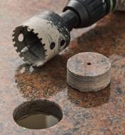A granite plug beside a hole drilled using the Montana 2" diamond hole-saw cup