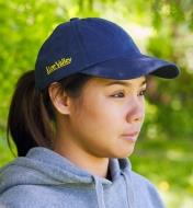 Side view of a model wearing a Lee Valley baseball cap displaying the Lee Valley name logo on the side