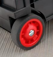 A close-up view of the wheel on a collapsible cart