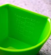 Close-up view of graduations marked on the inside of a scoop measuring bowl