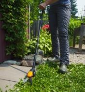 Trimming along a walkway with the Long-Handled Grass Shears 