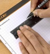 Using a pencil and a Veritas bench rule to render a scale drawing on a Veritas scratch pad