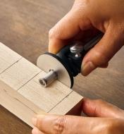 Using a replica micro-adjust wheel marking gauge to mark out a mortise on a wooden workpiece