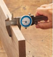 Measuring a board with the Fractional/Decimal Inch Combination Caliper