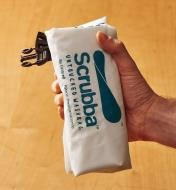 Holding a folded Scrubba wash bag in one hand