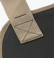 Close-up of stitching of a strap attached to the apron tote