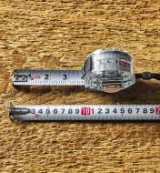 Two tape measures, one showing Imperial units on one side, the other marked in metric on the reverse