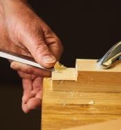 Chiselling out the waste on a tenon