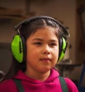 A child wearing hearing protectors
