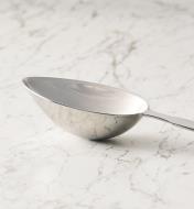 Profile view of a measuring spoon