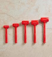 All sizes of dead-blow hammers lined up