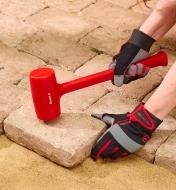 Using a 45 oz hammer to install patio stones
