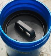 A bucket lid insert inside a 5 gallon bucket