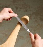 Using a Corradi half-round rasp to shape a wooden furniture leg