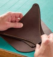 Placing three pieces of leather on top of each other