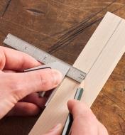 Using a pencil and a 4" combination square to mark a line at 90° to the edge of a wooden workpiece