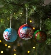 3D puzzle Christmas ornaments hanging from a holiday tree