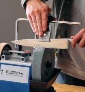 Sharpening a kitchen knife using a Tormek T-4 sharpening machine and a centering knife jig