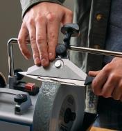 Sharpening a thin kitchen knife using a Tormek sharpening machine and a wide centering knife jig