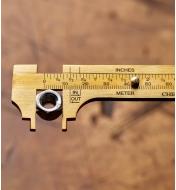 Measuring a nut with a Brass Caliper