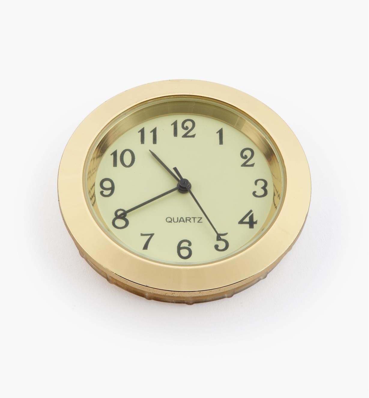 44K0154 - Horloge, cadran ivoire à chiffres arabes, lunette or