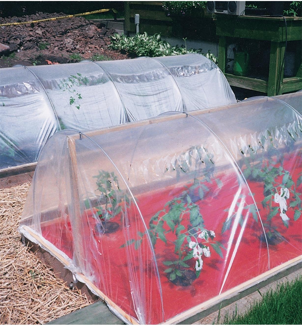 Hoops used to hold plastic film over garden rows