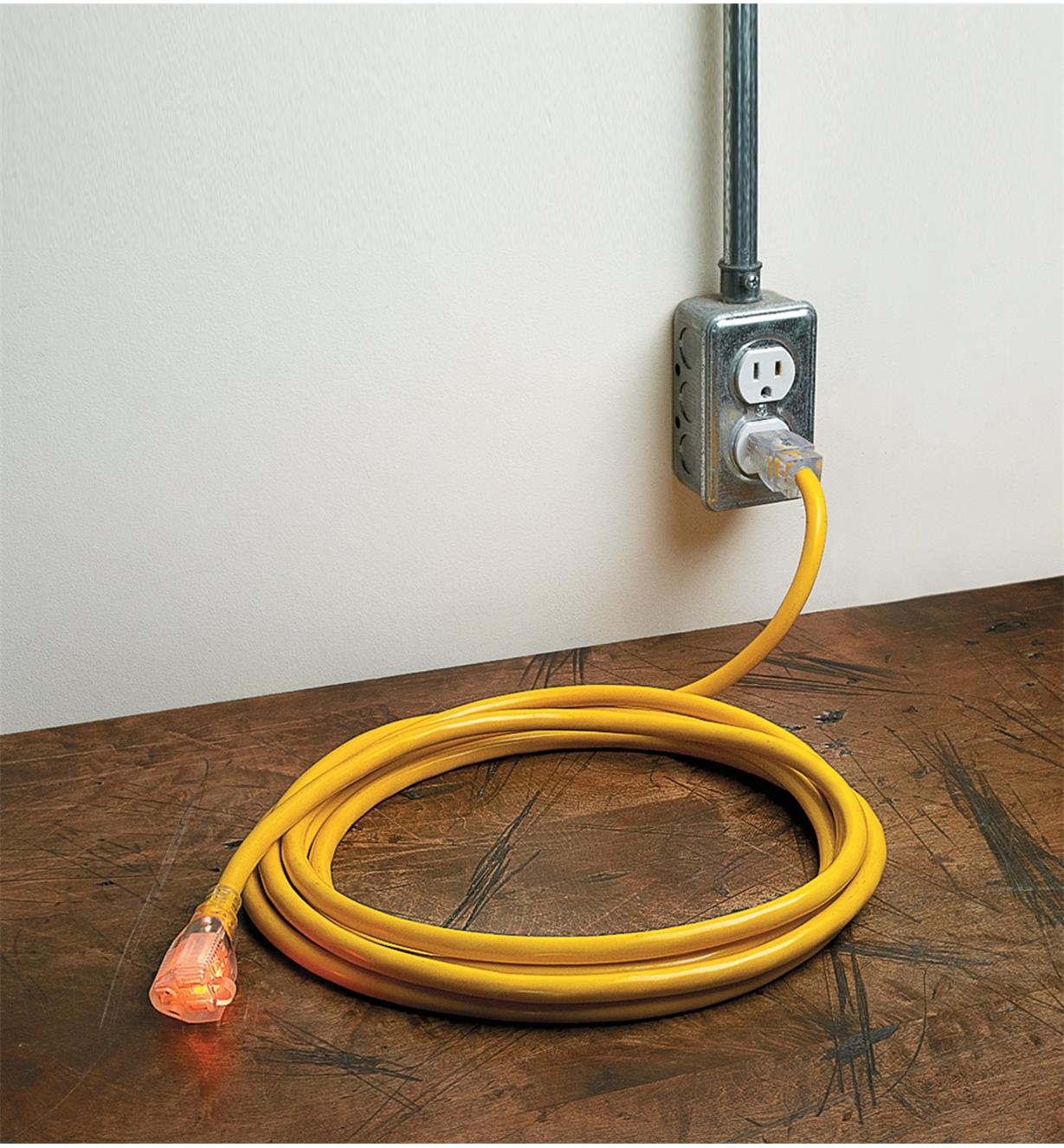 15' Heavy-Duty 12-Gauge Extension Cord plugged into an outlet