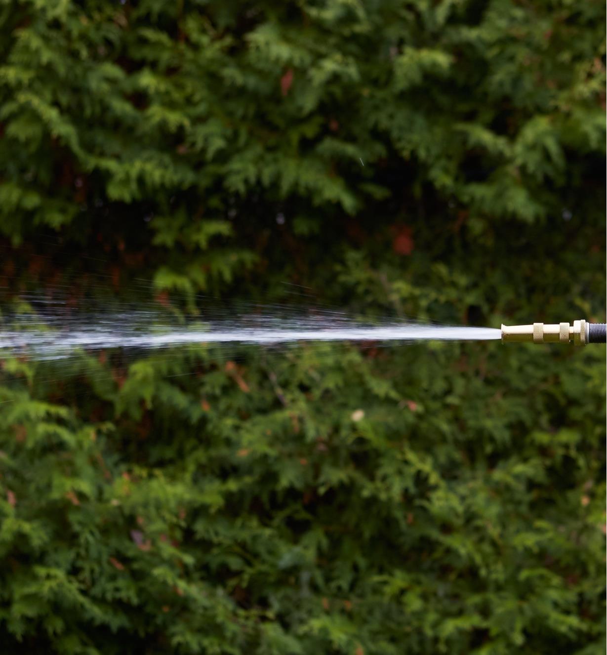 Brass Hose Nozzle spraying a sharp stream of water