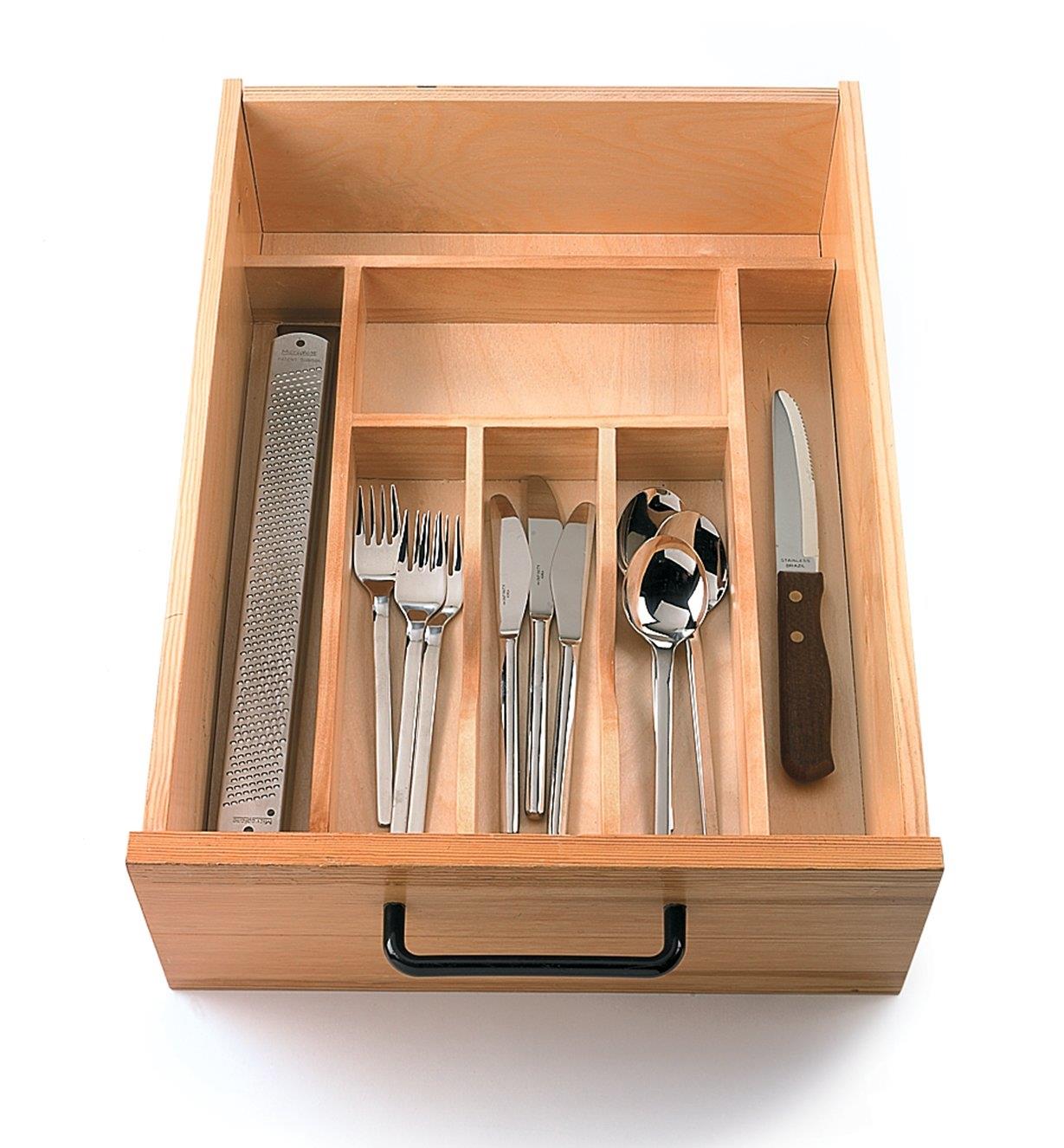Small tray in drawer, filled with utensils