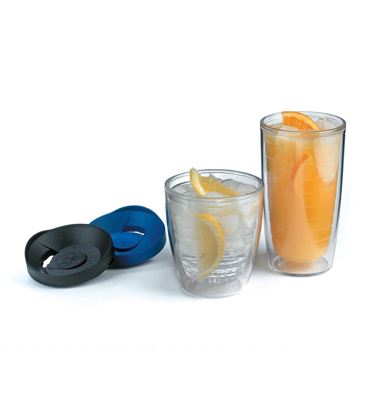 Two Tervis Tumblers filled with beverages and lemon and lime wedges