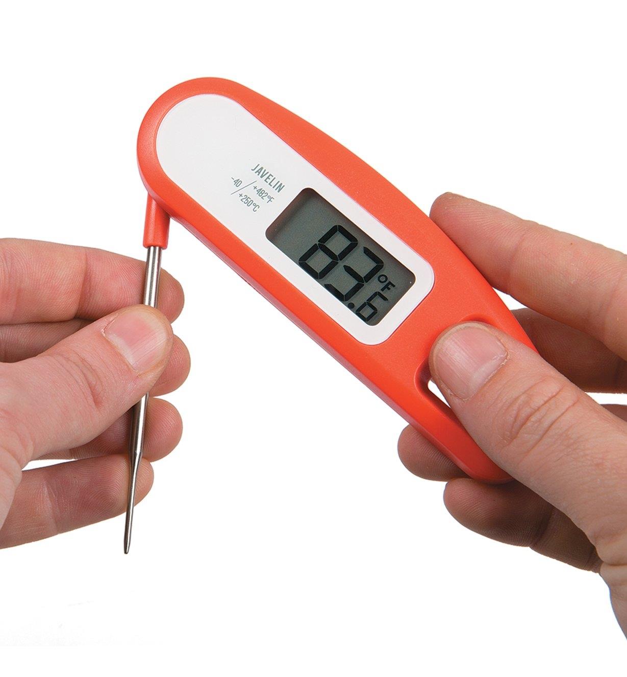 Folding the probe against the thermometer