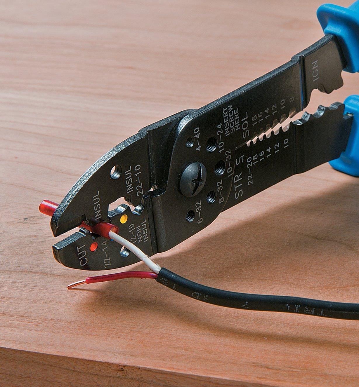 Cutting wire with a Crimper/Wire Stripper