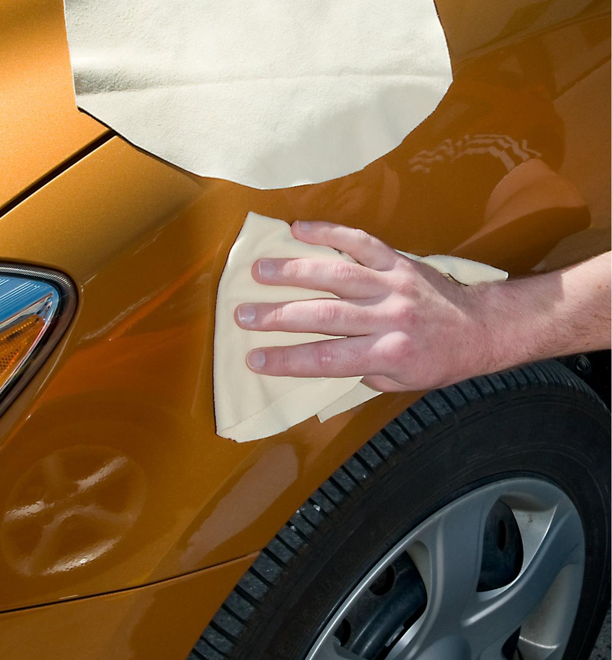 Cleaning a car with chamois