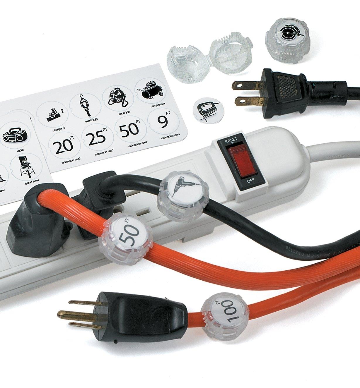 A power bar with cords plugged in or lying to the side, each with a large cord identifier attached