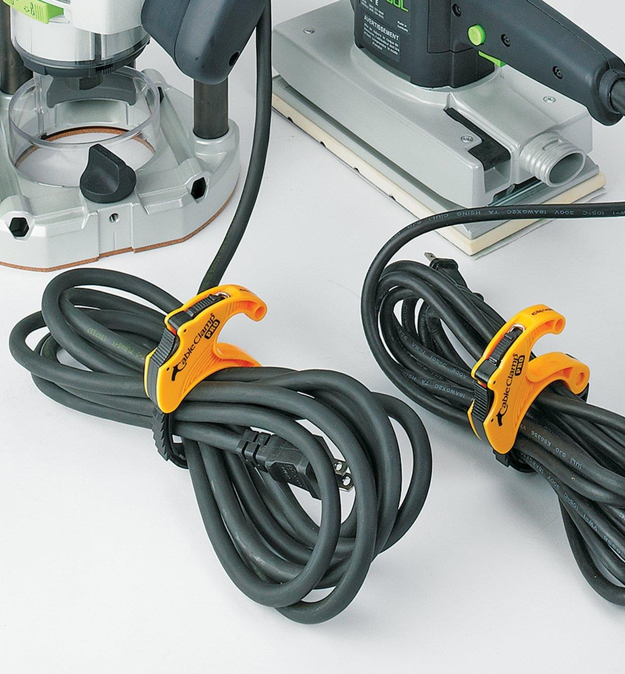 Looped power tool cords secured by medium CableClamps