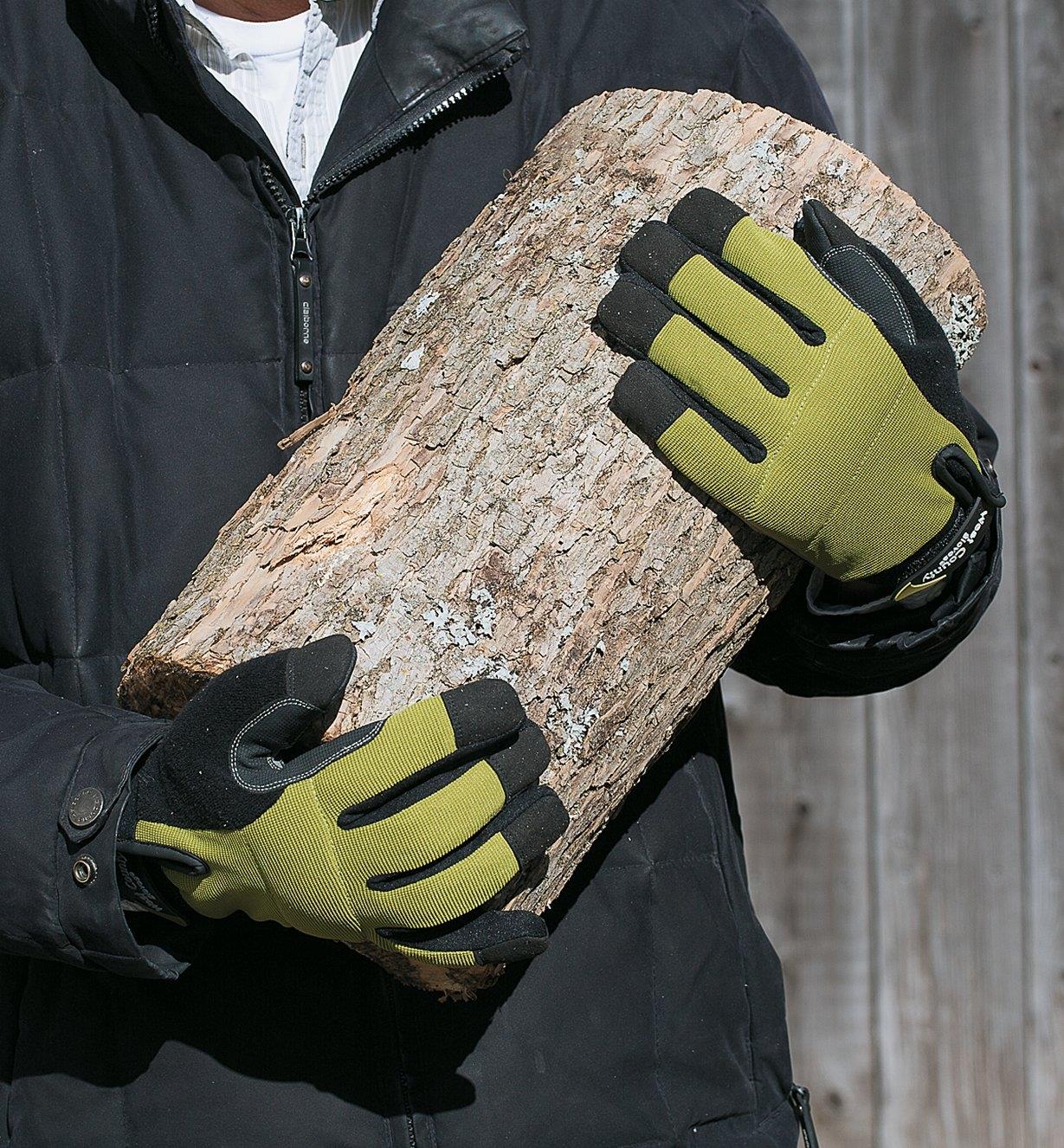 Holding a log while wearing Cold-Weather Gloves