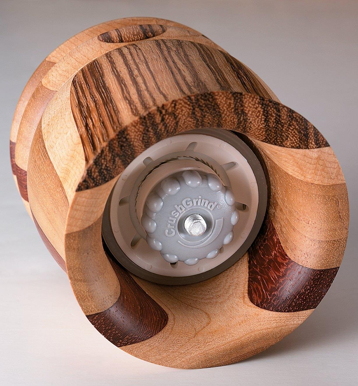 Bottom view of wooden pepper mill with mechanism installed