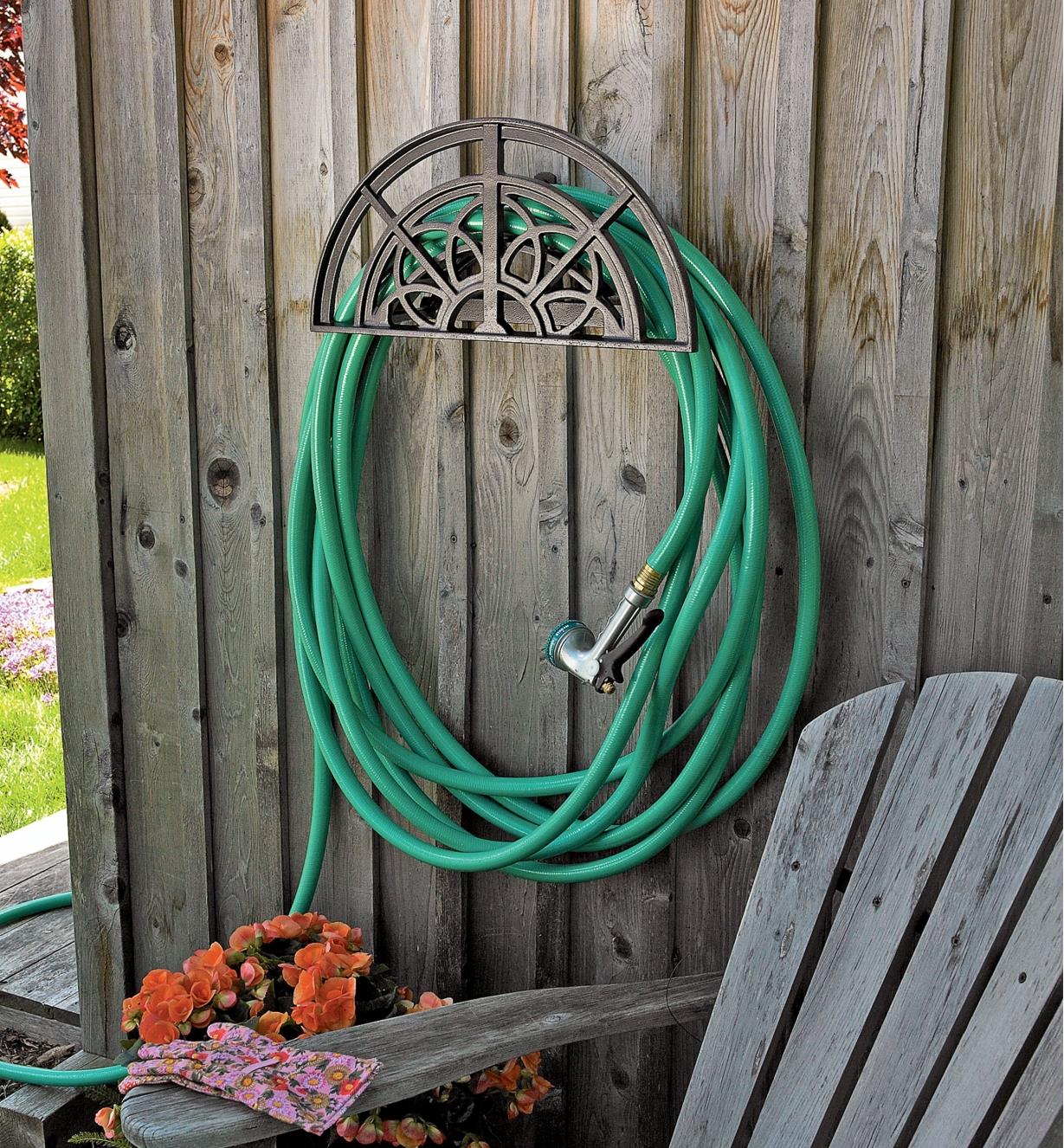 Classic Hose Hanger mounted on a wall, with a hose looped around it