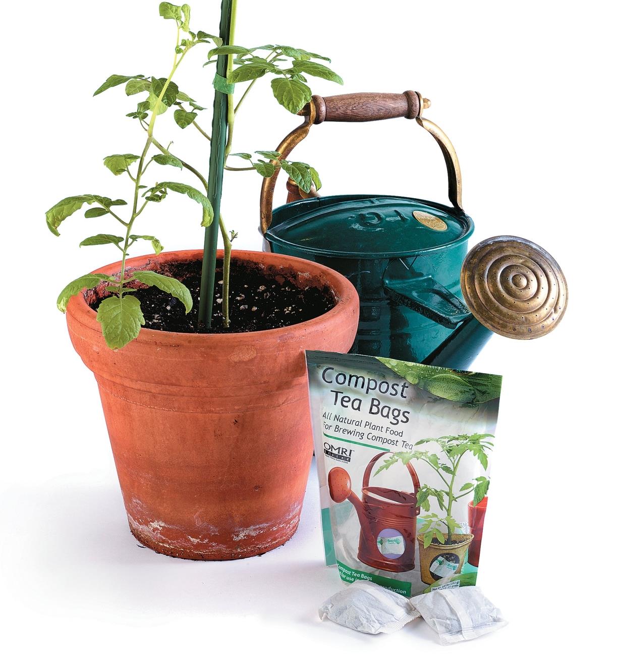 Package of Compost Tea Bags next to a potted plant and a watering can