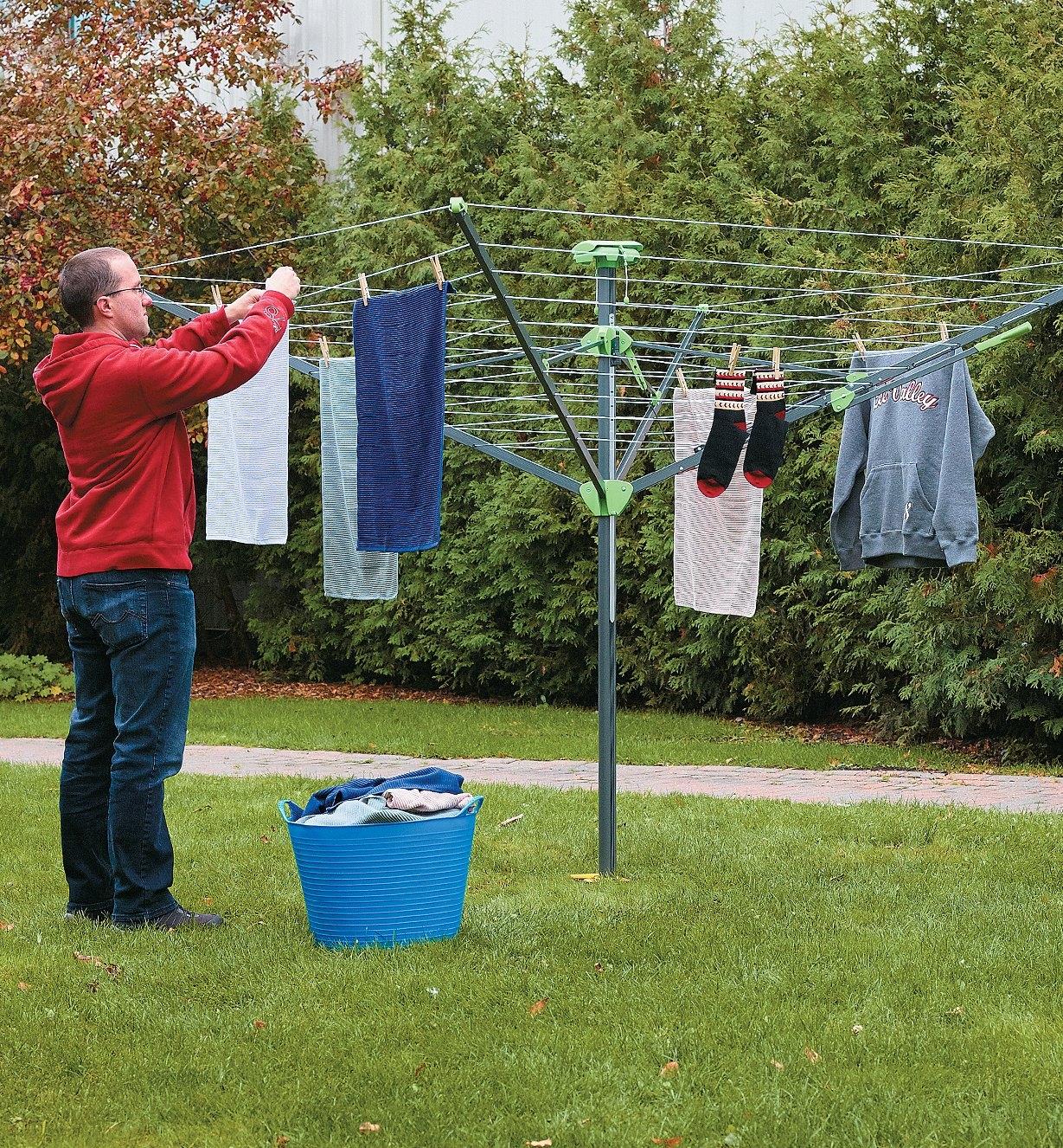 Folding Clothes Dryer with laundry hanging from the drying lines