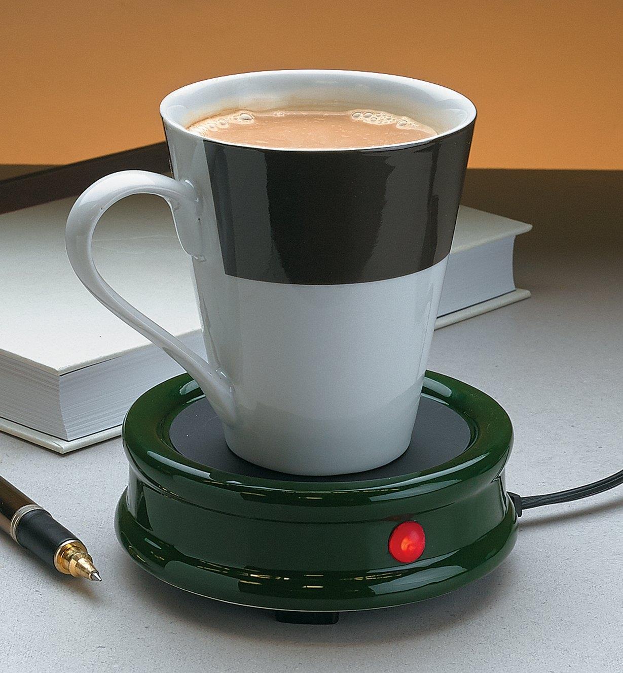 Cup of tea sitting on a Tabletop Warmer