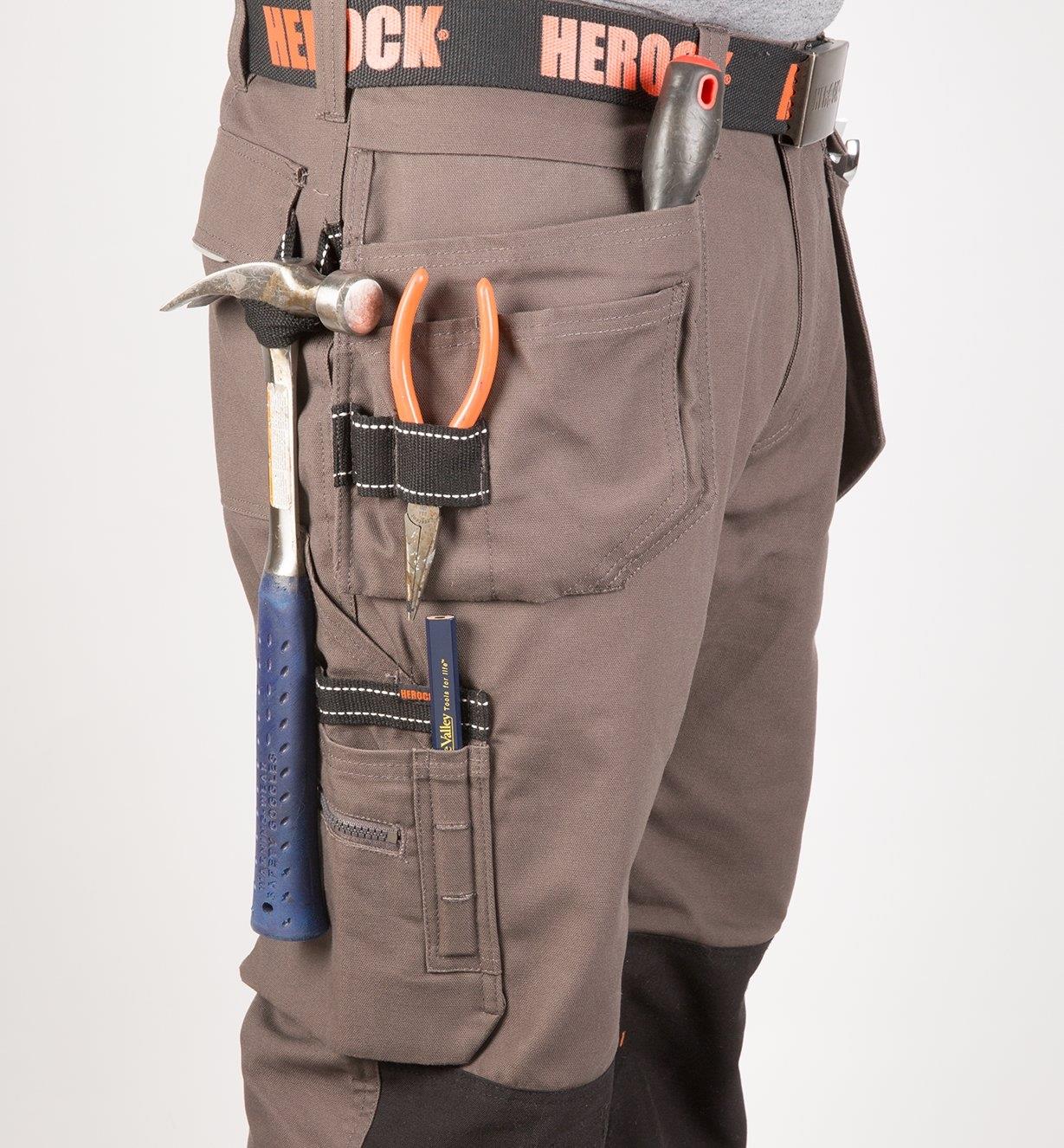 Side of Gray Heavyweight Pants with tools in pockets and loops