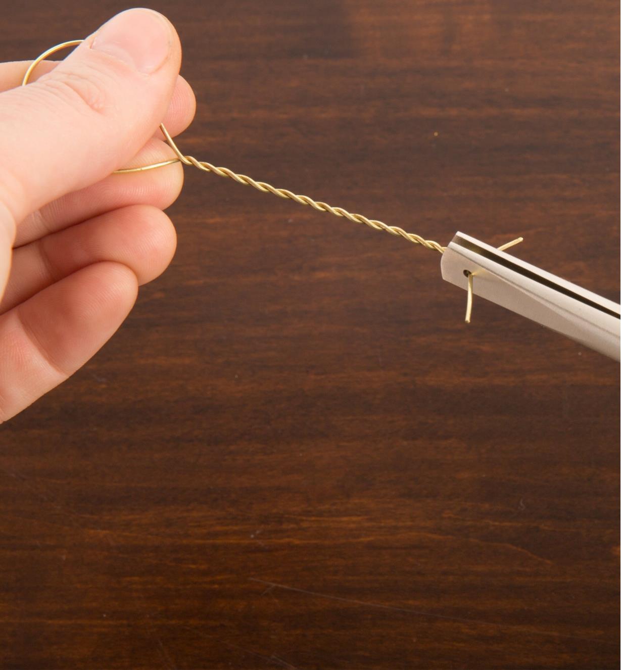 Using duck-bill pliers to twist wires