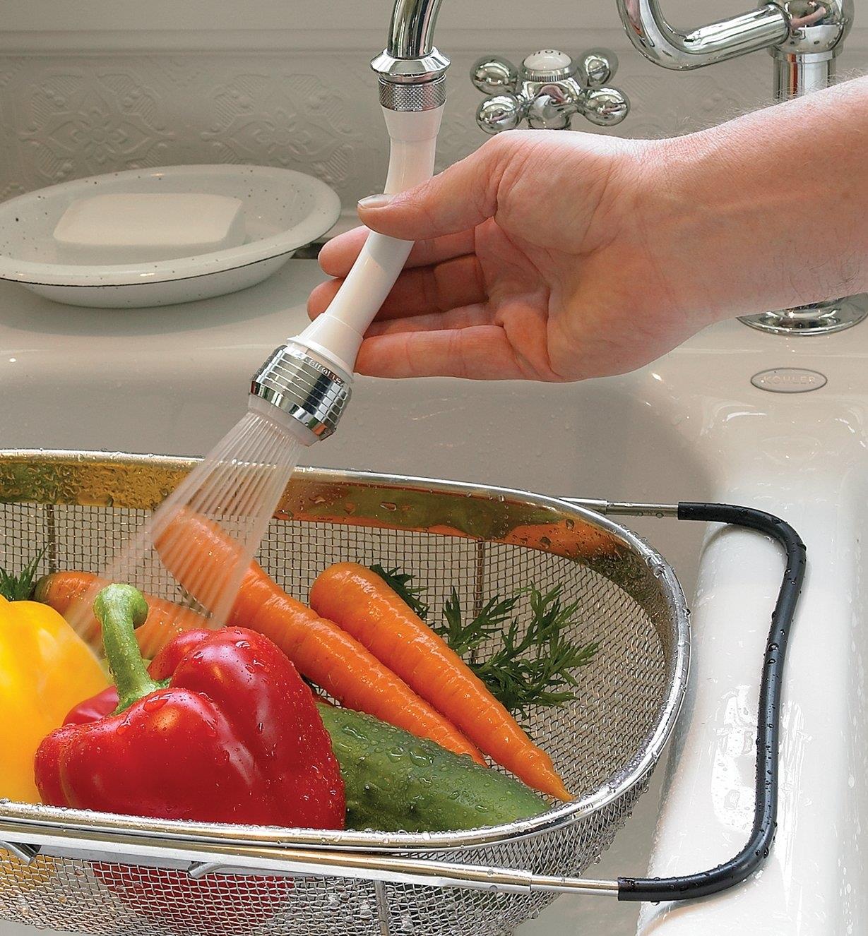 Rinsing vegetables in a colander using the Flexible-Neck Sprayer