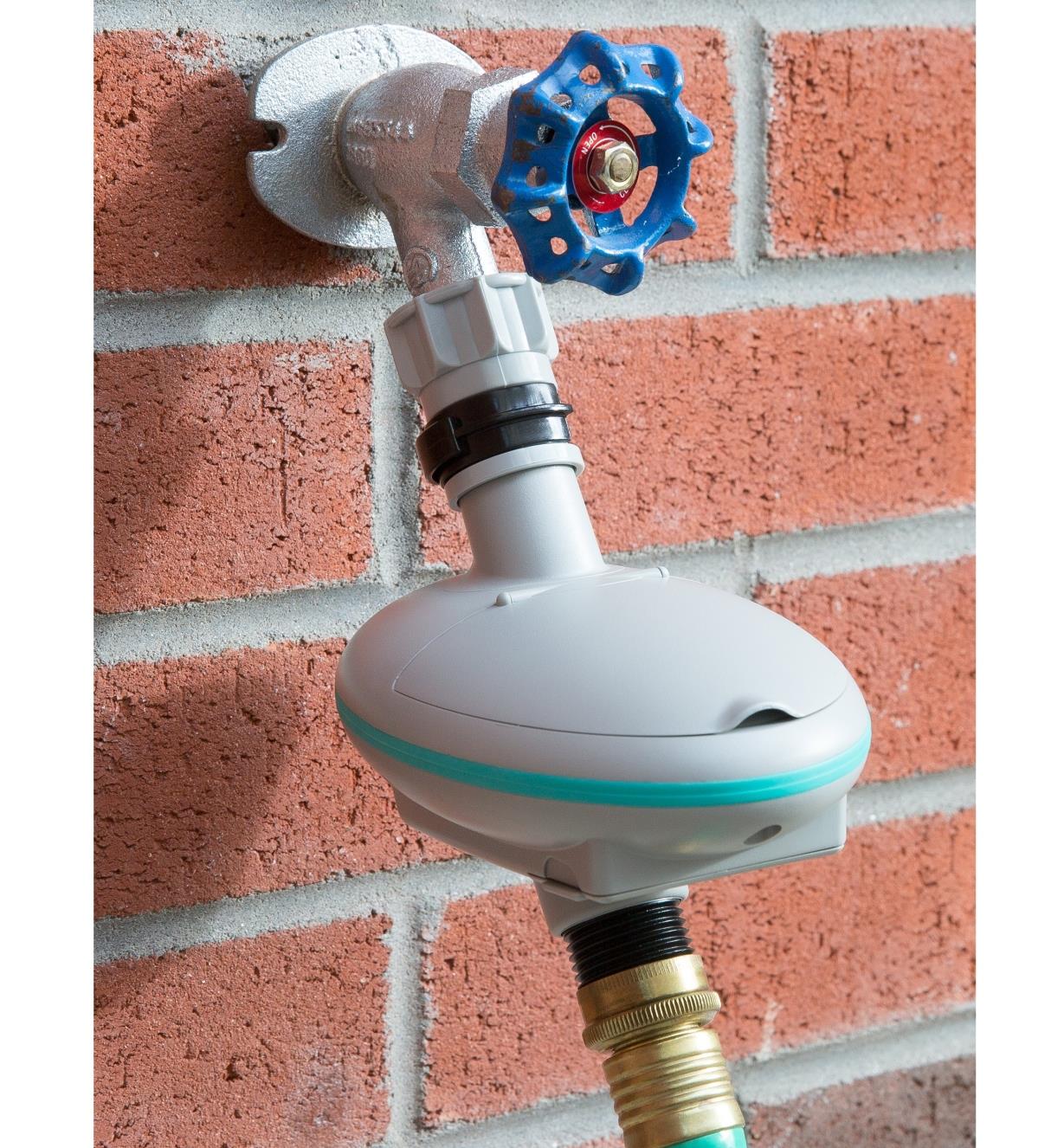 Dial-Operated Water Timer connected to a faucet and hose