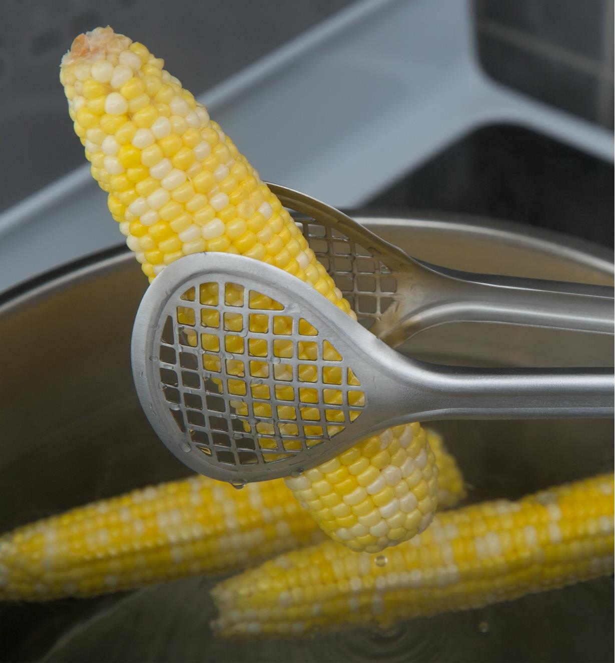 Using Grill Fry Tongs to remove a cob of corn from a pot of water